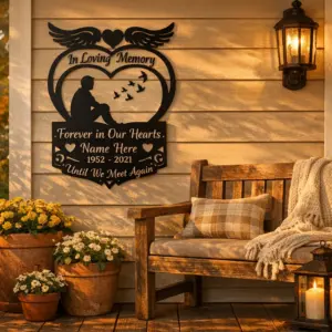 Front porch with personalized loss remembrance decor metal sign hung near potted plants