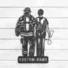 Metal wall art silhouette of a firefighter and nurse standing side by side with a stethoscope and helmet, mounted on white shiplap with a base reading "CUSTOM NAME"