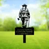 style-13.-Firefighter-Memorial-2 Silhouette memorial lawn sign showing a firefighter from behind holding an axe and tool, with text placeholder “In Loving Memory of CUSTOM NAME 1955-2025” against a grassy blurred background