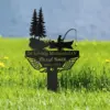 Black metal memorial stake in grass with canoe fishing scene, pine trees, angel wings and the name "Russel Smith" with dates 1963 - 2025