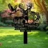 Black metal memorial yard sign with deer head silhouette, flying duck and jumping fish, text reading "In Loving Memory Of" and placeholder "CUSTOM NAME 1950 - 2025", staked in a sunlit garden lawn