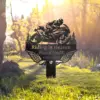 style-17.-Riding-in-Heaven-2 Black metal memorial sign with a motorcyclist silhouette, wings and trees reading "Riding in Heaven" and name "Russel Smith" with dates 1963–2025, staked in sunlit grassy yard