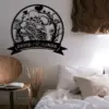 Black circular wall decal of two embracing skeletons surrounded by roses and hearts with banner reading 'DAVID ♥ LINDA' above a cozy bed and chair