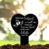 Black heart-shaped memorial stake in garden mulch reading “There is no footprint so small that it does not leave an imprint on this world” with baby footprints, name Juliette and date August 7, 2021