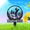 Metal yard sign silhouette of a golfer swinging inside a golf ball shape with trees and flag, mounted stake with text 'CUSTOM NAME' in front of a sunny grassy background