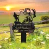 Metal memorial yard sign with fisherman catching a large fish reading “In Loving Memory of Jacob Henderson 1956 - 2024” set in a grassy field at sunrise