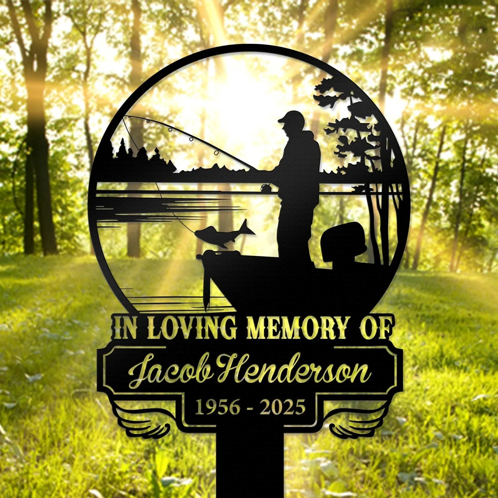 Black memorial yard sign silhouette of a fisherman in a boat with a fish, text reading "In Loving Memory of Jacob Henderson 1956 - 2025" against a sunlit forest background