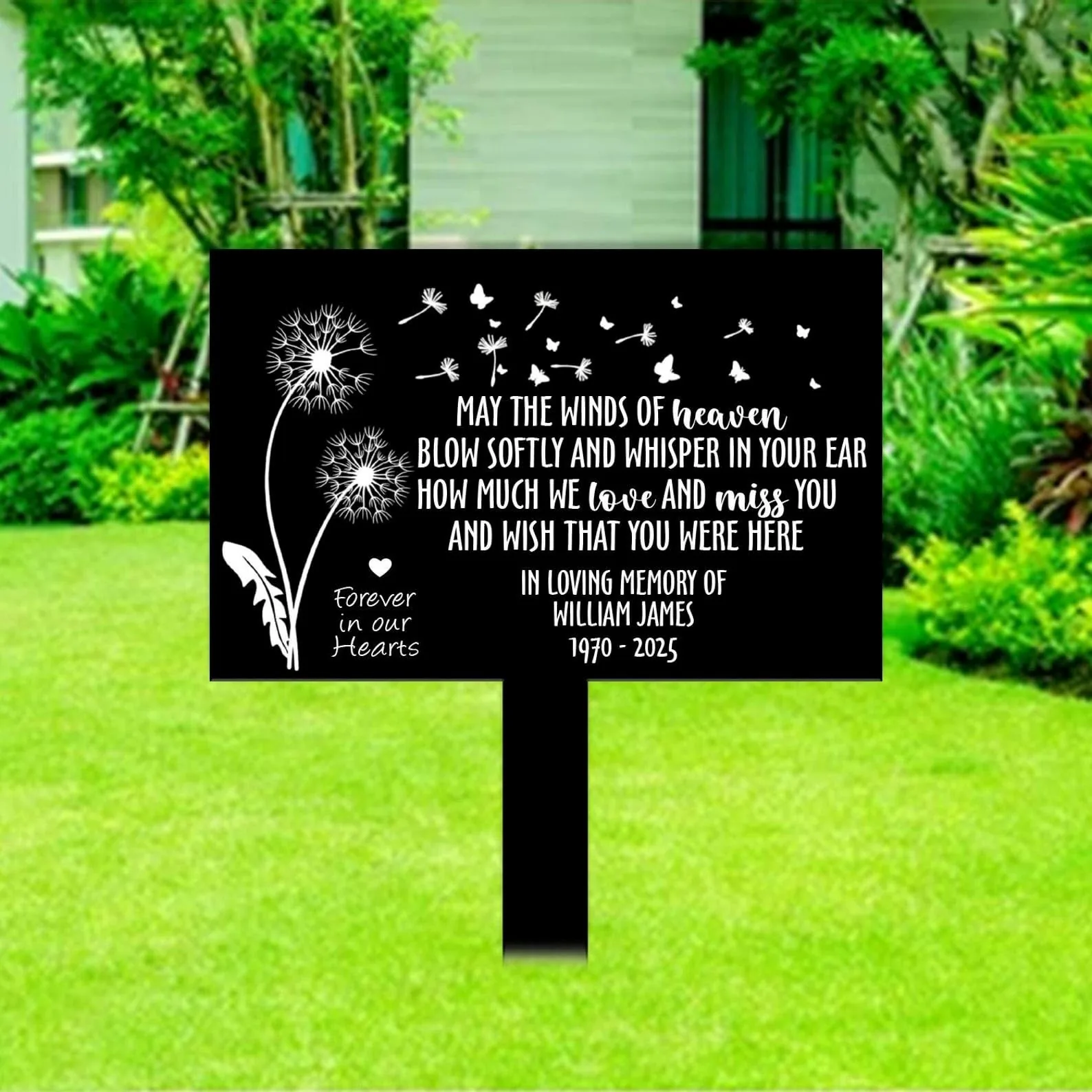 style-40.-Dandelion-Heaven-1 Black memorial yard sign with white dandelion and butterflies design reading a condolence poem and "In loving memory of William James 1970-2025," staked on green lawn