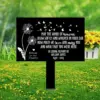 style-40.-Dandelion-Heaven-2 Black memorial sign with white dandelion and butterfly graphics reading “May the winds of heaven blow softly and whisper in your ear how much we love and miss you” and personalized name and dates, placed in a grassy field with yellow flowers