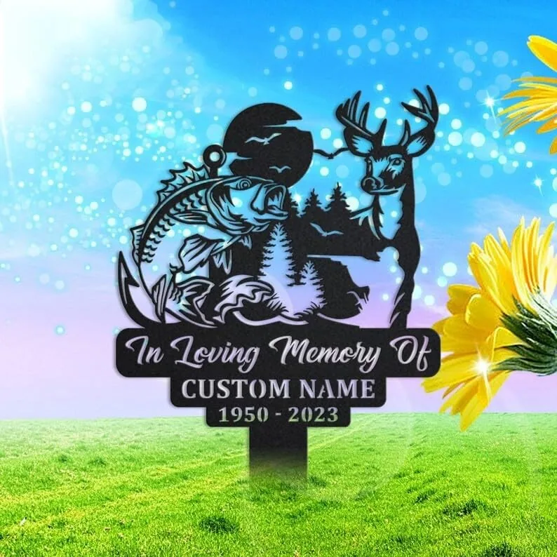 Black metal memorial yard sign showing a fish, deer, trees and moon with text "In Loving Memory Of" and customizable name and dates, placed on grass with blue sky background