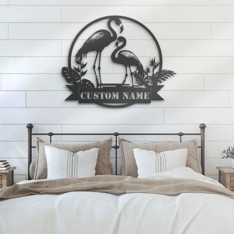 style-8.-Flamingo-Couple-2 Bedroom with metal flamingo wall art reading "CUSTOM NAME" mounted above a farmhouse bed with neutral pillows and shiplap wall