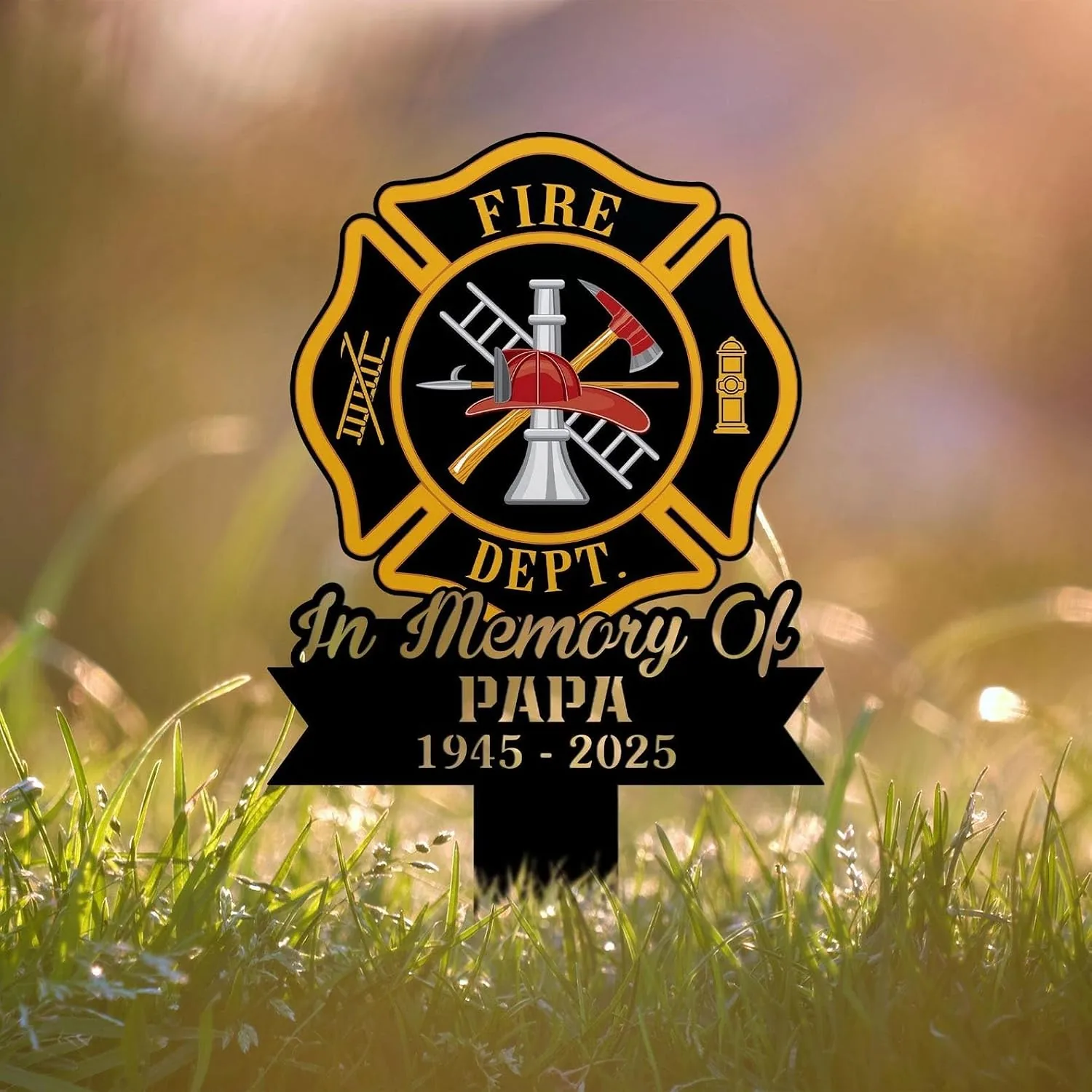 Maltese cross firefighter memorial yard sign with helmet, axe, ladder and hydrant emblem and text “In Memory Of PAPA 1945 - 2025” staked in sunlit grass