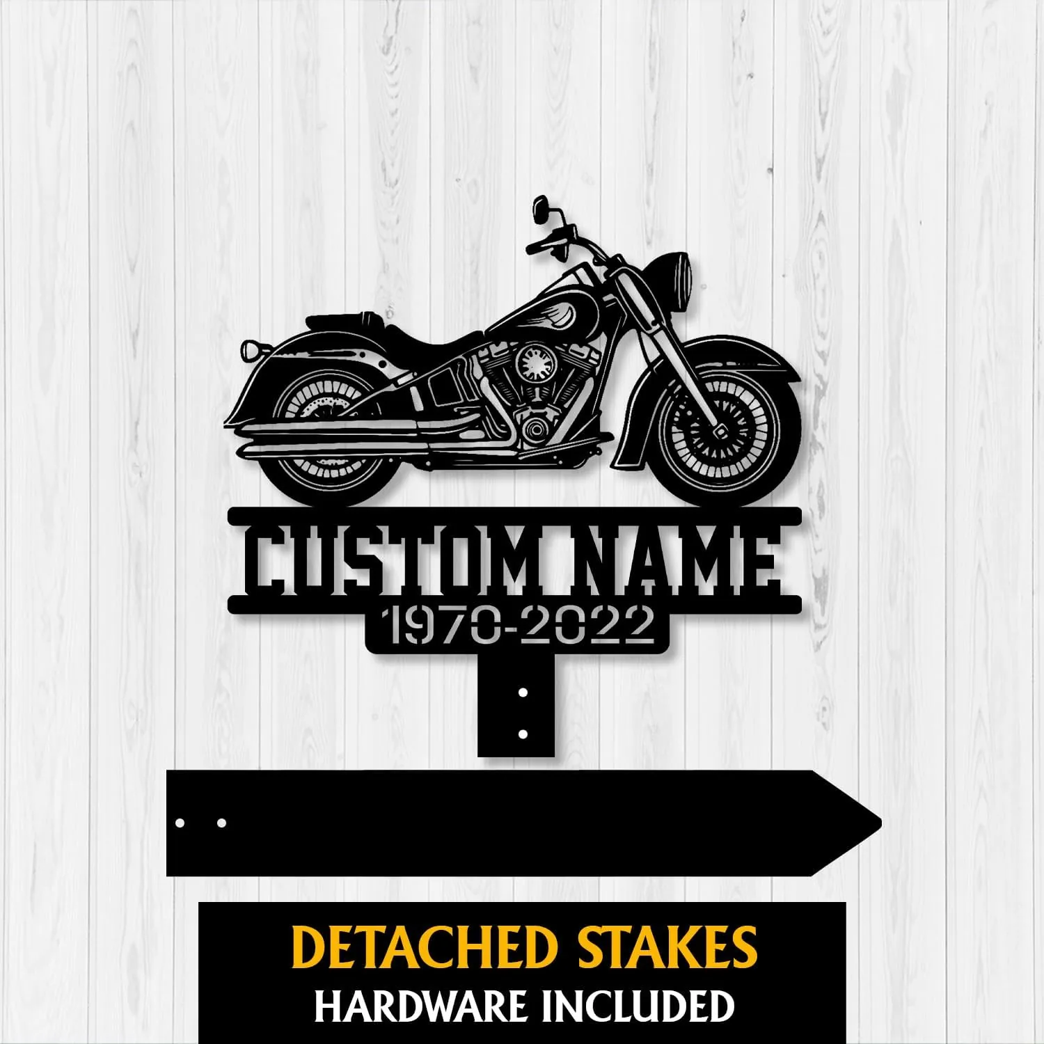 Black metal motorcycle silhouette sign with text placeholder "CUSTOM NAME" and years "1970-2022" on a white wood background, detached stakes shown