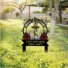 Memorial yard sign with anchor, rope and roses reading "In Loving Memory" and placeholder text "CUSTOM NAME 1950–2024" staked in a sunny park lawn