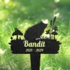 Black garden memorial stake shaped like a hedgehog with mushrooms and plants, text "Bandit 2021 - 2024" on a grassy background