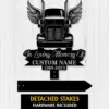 Black metal memorial sign showing front of a semi truck with wings and text reading "In Loving Memory Of" and placeholder "CUSTOM NAME 1969-2023" on a white wood background