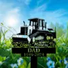 304 Black silhouette memorial sign of a bulldozer in a grassy field with blue sky, reading "In Loving Memory of DAD 1949-2024"