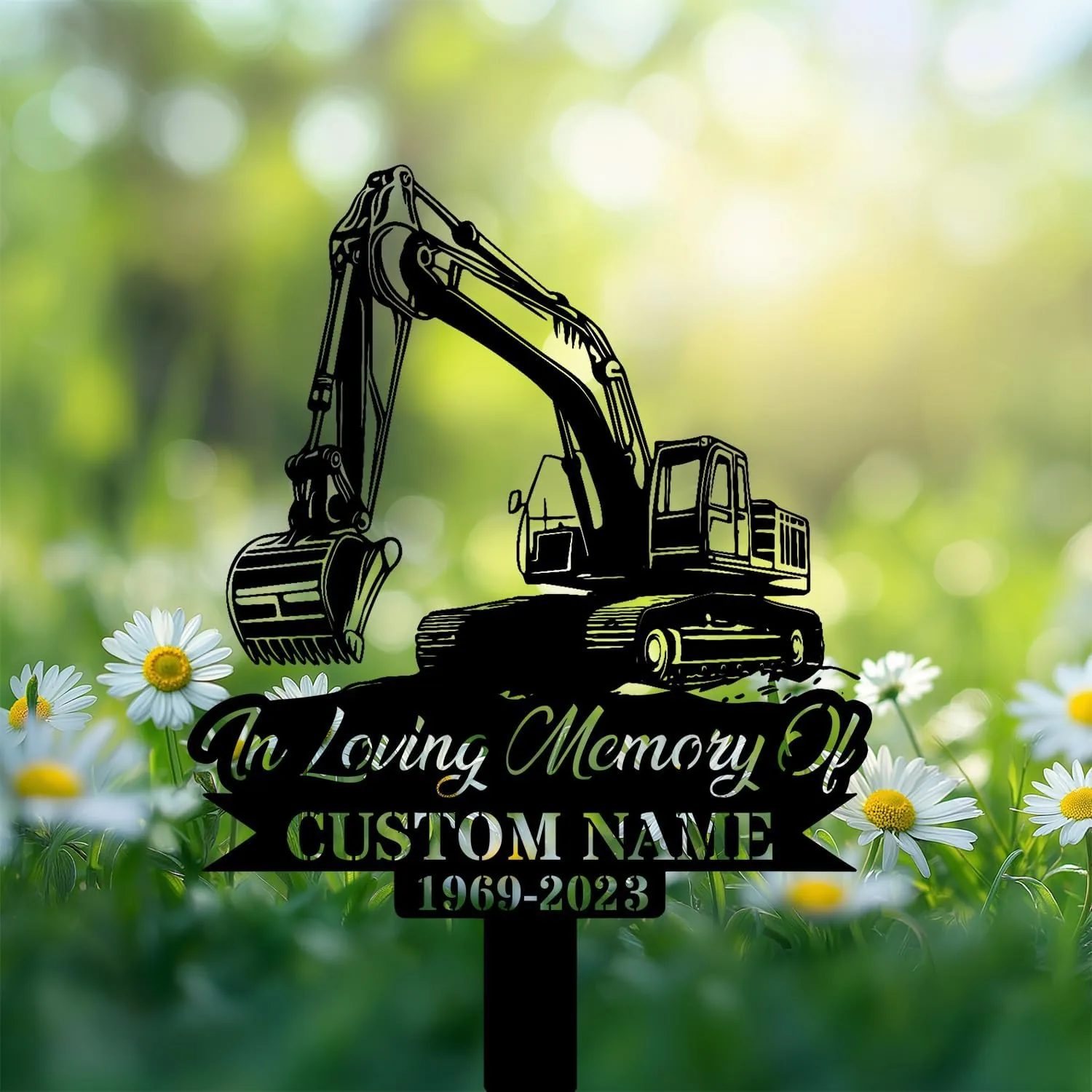 Black silhouette memorial sign of an excavator with text placeholder "In Loving Memory Of" and "CUSTOM NAME 1969-2023" set among daisies in a sunlit green field