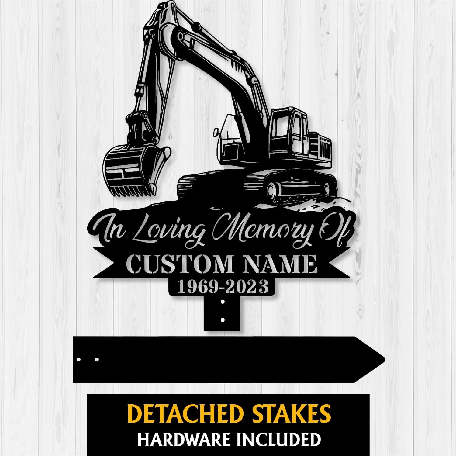 Black metal memorial sign with excavator graphic reading "In Loving Memory Of" and placeholder "CUSTOM NAME 1969-2023" shown on a light wood background