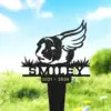 93-1 Black metal memorial yard stake showing a guinea pig with wings, grass details and name 'SMILEY' above dates '2021 - 2024' against a sunny grassy background