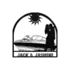 style-16.-Motorboat-Couple-1 Black silhouette metal sign showing a couple kissing beside a motorboat under a sun, with the names "JACK & JASMINE" at the bottom