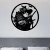 style-18.-Samurai-Geisha-3 Black circular metal wall art above a bed showing a silhouetted samurai couple with bamboo and a sword in a minimalist bedroom