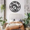 style-21.-Wolf-Couple-3-2 Bedroom with modern gold headboard, rust-colored bedding, plants, and a round black wall sign reading "MR AND MRS TADDOUGH" with wolf couple graphic