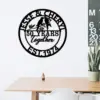 style-29.-Parrot-Couple-3 Black round wall sign reading "Jesse & Cheryl" at top, "50 Years together" in center with two birds on a branch, and "Est. 1974" at bottom, hung above a minimalist desk