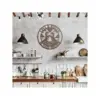 style-32.-Otter-Couple-3 Rustic kitchen with wooden countertop, hanging pendant lights, open shelves and a round metal wall sign reading 'Lisa & Brian 10 Years Together' above the sink