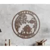 Rust-colored metal wall art showing a couple sitting on a bench under a tree with a sign reading 'EST 1974', names 'MIKE & KERI' at top and '50 YEARS TOGETHER' along bottom, mounted on a textured gray wall
