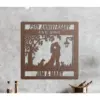 style-37.-Autumn-Dog-Cat-2 Rust-colored metal wall art reading "25th Anniversary EST. 1999" with silhouette of a couple kissing under a tree, two dogs, a lamp, and the names "Jim & Mary" mounted on a concrete wall