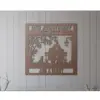 Metal wall plaque reading "50th Anniversary Est. 1974" with a couple sitting on a bench, a dog, tree and lamp silhouette, personalized "Jim & Mary", mounted on shiplap wall