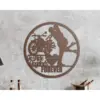 Round metal wall art with a motorcycle silhouette, kissing couple silhouette, and text 'To Ride Together FOREVER' mounted on a textured gray wall